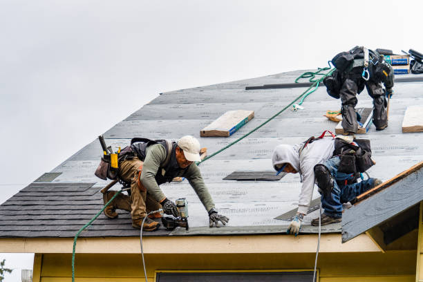 Professional Roofing technician working in Center, ND